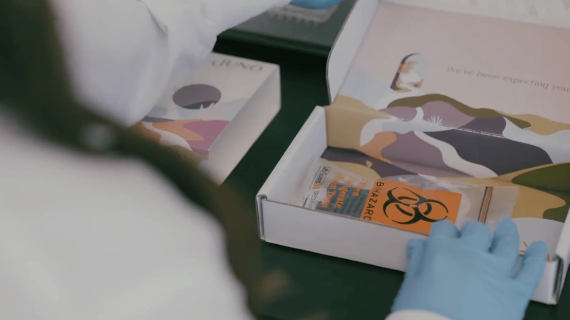 A Juno lab technician opens a blood sample to process a noninvasive screening screen (NIPS)